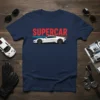 Supercar text graphic with a white sports car illustration and speed lines on a navy blue t-shirt