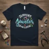 Support Your Local Jeweler T-Shirt featuring colorful text and jewelry graphics like rings and earrings
