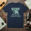 Surf Montana t-shirt design featuring a large ocean wave, pine trees, and mountains, with the text "SURF MONTANA"