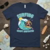 Surfing Goofy Bigfooter t-shirt design featuring Bigfoot surfing a wave, with text "SURFING GOOFY BIGFOOTER" and ocean elements