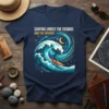 Surfing Under The Cosmos Ride The Universe text on a navy t-shirt with a surfer riding a cosmic wave illustration