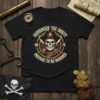 Black t-shirt with "Surrender The Booty Prepare To Be Boarded" pirate design, featuring a skull, crossed swords, and rope circle