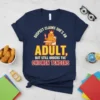 T-shirt with the quote "Suspect Claims She's An Adult, But Still Orders The Chicken Tenders" featuring a cartoon character in