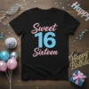 Black t-shirt with "Sweet 16 Sixteen" text in pink and blue, celebrating a 16th birthday