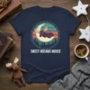 Sweet Dreams Moose t-shirt design featuring a moose sleeping on the moon amidst pine trees and stars, with bold text