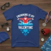 Swimming Is My Valentine t-shirt with a red swimmer in white water and blue hearts graphic
