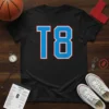 Black t-shirt with a large blue 'T8' graphic outlined in white and red, representing a basketball team number