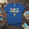 Tacky Tourist 1 design on a blue t-shirt, featuring rainbow colors and the number 1 graphic