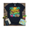 Tacky Tourist t-shirt design with tropical flamingo, palm trees, and bold text