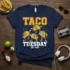 Taco Tuesday Est 2024 t-shirt with dancing tacos and bold text, navy blue shirt with yellow and white lettering