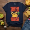 Tacocat Spelled Backwards Is Tacocat T-Shirt with a cat holding tacos and wearing heart-shaped sunglasses