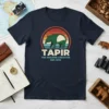 Vintage style t-shirt design featuring a green tapir graphic with text TAPIR THE AMAZING CREATURE EST. 1970