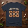 Tarantula Tricks Sit Fetch Shake Come Roll Over Stay t-shirt design featuring six circular graphics of tarantulas performing commands