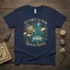 Tea Party At Dusk Magical Blends t-shirt design featuring a golden teapot pouring into a lotus cup, surrounded by dandelions
