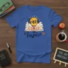 Teach SMILE Inspire t-shirt design with a smiling sun over an open book and floral accents