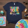 Teacher Mode Off t-shirt design with colorful typography, books, apple, sunglasses, and a beach scene