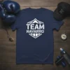 TEAM NAVARRO text logo on a navy blue t-shirt, part of a sports-themed flat lay with boxing gloves and a