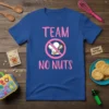 Blue t-shirt with "TEAM NO NUTS" in pink text, featuring a chef's hat and whisk crossed out in a pink