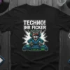 Black t-shirt featuring a cartoon cat DJ with "TECHNO! IHR FICKER" text above, surrounded by vinyl records and synthesizers