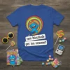Blue t-shirt with "tem bluudude get inn nowww!!" text and a cartoon blue character holding a lollipop, set against a
