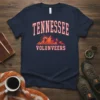 Tennessee Volunteers t-shirt design with a vibrant mountain sunset graphic and arched text