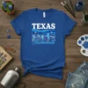 Texas Bluebonnets t-shirt design with white "TEXAS" text above a landscape of bluebonnet flowers and wavy blue lines