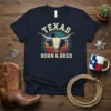 Texas Born & Bred t-shirt with a vintage longhorn skull graphic and sunset background