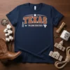 Navy t-shirt with "TEXAS THE LONE STAR STATE" in orange and white, featuring Texas icons like an oil derrick and