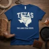 Texas map outline with longhorn skull graphic and "TEXAS THE LONE STAR STATE" text on a blue t-shirt