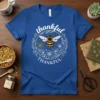 Blue t-shirt with "thankful THANKFUL" text and a bee illustration in a floral wreath
