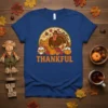 Thankful Thanksgiving t-shirt with cartoon turkey, gnomes, pumpkins, and cornucopia graphic. Features bold orange text