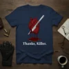 Navy blue t-shirt with "Thanks, Killer." text below a graphic of an anatomical heart pierced by a scalpel, with blood