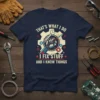 T-shirt featuring the quote "That's What I Do I Fix Stuff And I Know Things" with a robot arm holding