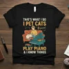 Black t-shirt with "That's What I Do I Pet Cats Play Piano & I Know Things" quote featuring a person