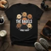 The Bagels Abbey Road t-shirt design featuring anthropomorphic bagels walking in a circle on a vinyl record graphic