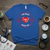 The Beat Goes On T-Shirt with red heartbeat line, crystal heart, and caduceus symbol