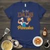 The Best DADS Make Pancakes t-shirt design featuring a muscular chef holding a stack of pancakes
