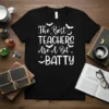 Black t-shirt with white text "The Best TEACHERS Are A Bit BATTY" and small bat graphics, designed for teachers