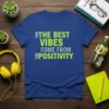 Blue t-shirt with bold green text "The Best Vibes Come From Positivity" design