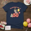 The Birthday Girl Is 50 text with a cute cat sitting on the number 50, balloons, gifts, and cupcake on