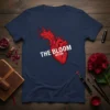 Anatomical heart graphic with white text "The Bloom Within" on a navy blue t-shirt, symbolizing growth