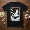 The Calico cat tarot card t-shirt design featuring a calico cat on clouds under a starry sky with a moon