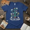 The Cat Gang United By Feline Fun t-shirt design featuring a whimsical tree filled with cats and houses