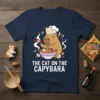 The Cat on the Capybara ramen t-shirt design with a cat chef on a capybara's head eating noodles