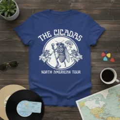The Cicadas North American Tour graphic tee featuring a cicada band with guitars and microphone, white print on blue shirt