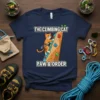 The Climbing Cat Paw & Order t-shirt design featuring an orange tabby cat climbing a rock wall with paw and