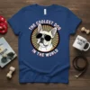 The Coolest Dog In The World text with a French Bulldog wearing sunglasses graphic on a blue t-shirt
