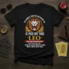 Black t-shirt with "The Dumbest Thing You Can Possibly Do Is Piss Off This Leo" quote and a roaring lion