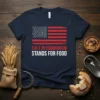 Navy blue t-shirt with distressed American flag and text: THE F IN COMMUNISM STANDS FOR FOOD. Political humor design