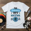 White t-shirt with "THE Fabulous 50'S ROCK 'N' ROLL" in blue and black, featuring retro graphics and musical notes